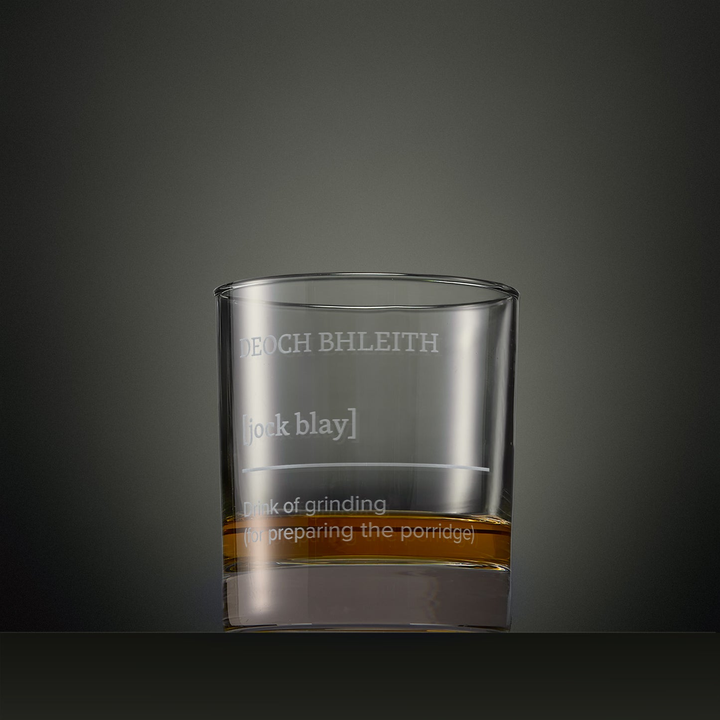 Engraved whisky glass featuring a Four Morning Drams Gaelic inscription with explanatory text.