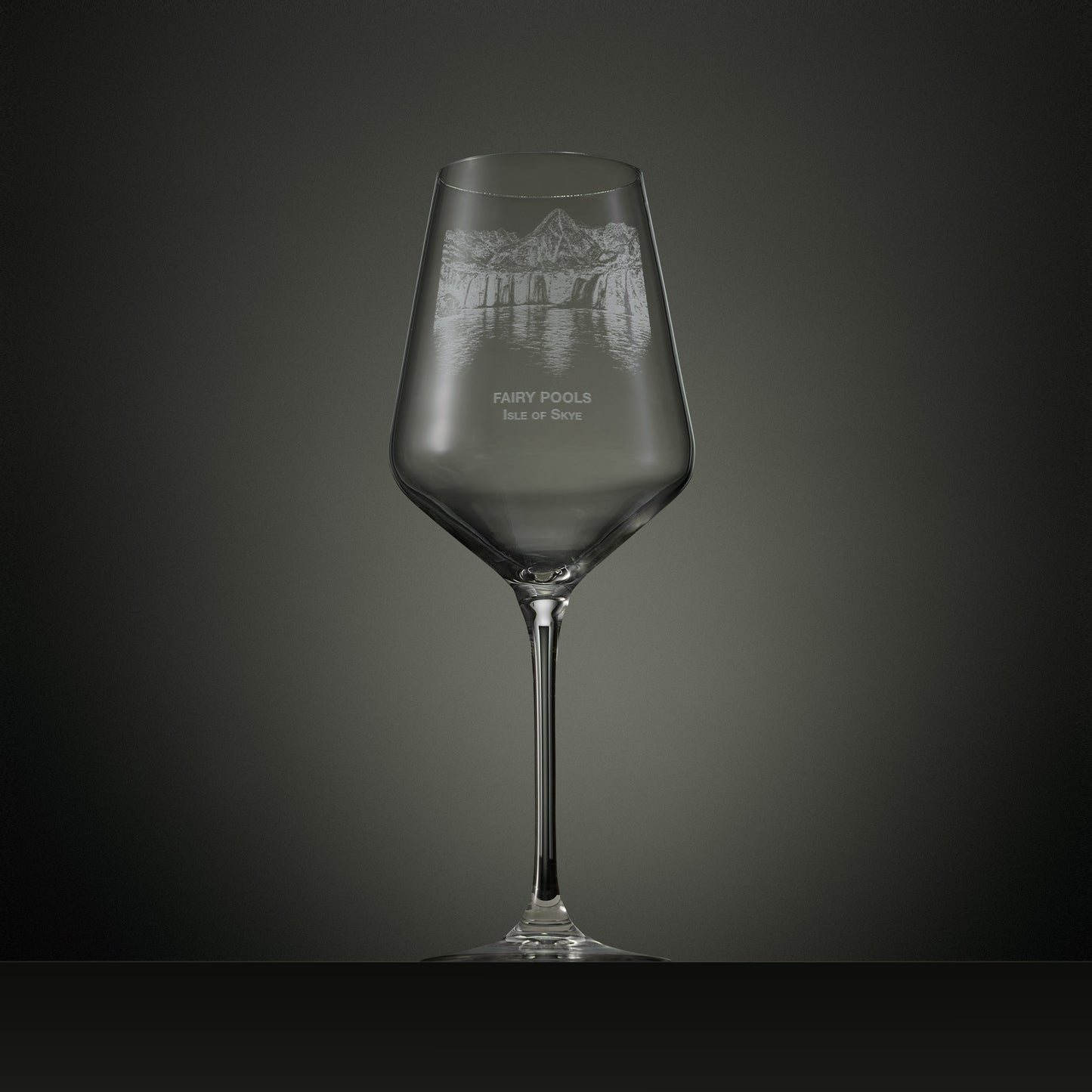 Engraved wine glass featuring the Fairy Pools on the Isle of Skye with cascading waterfalls, reflective pools and the Black Cuillin mountain range.