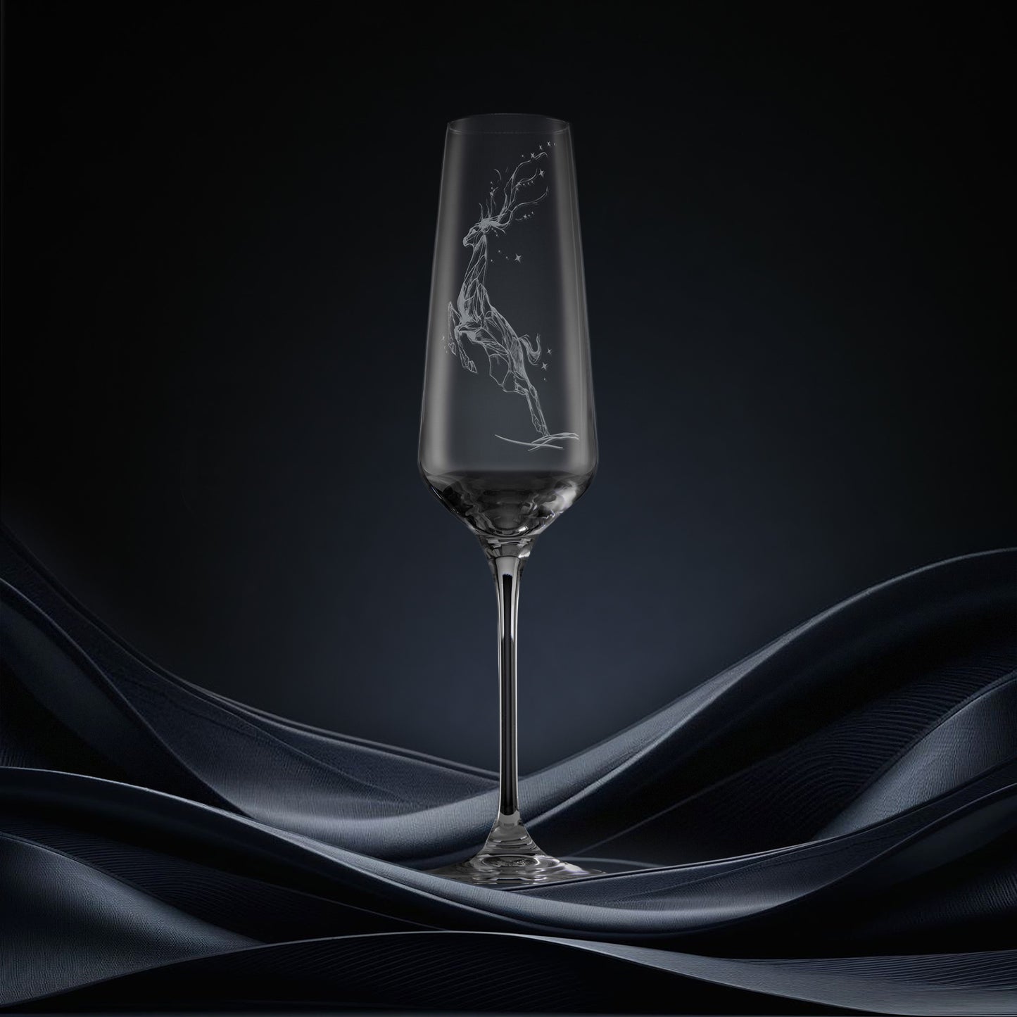 Engraved champagne flute featuring a leaping stag forming a constellation of stars