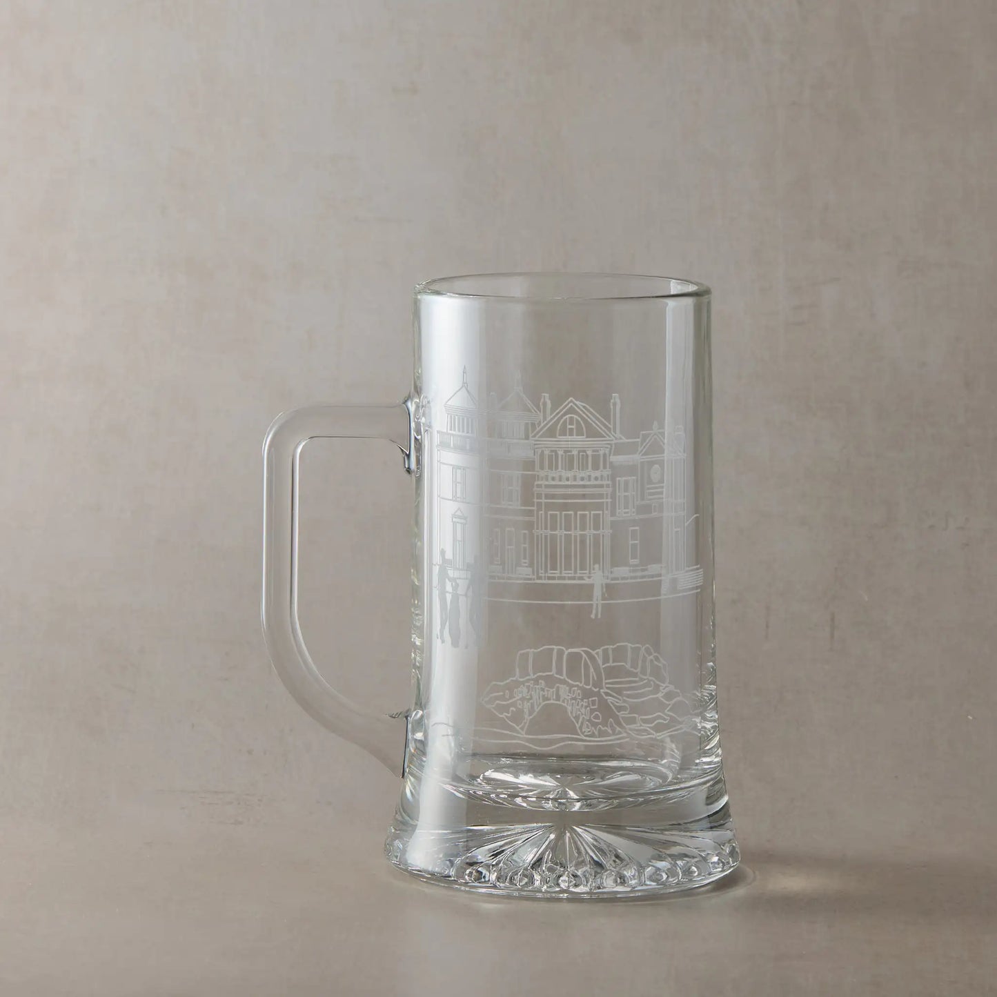 Engraved glass tankard with St Andrews illustration, handle left of design