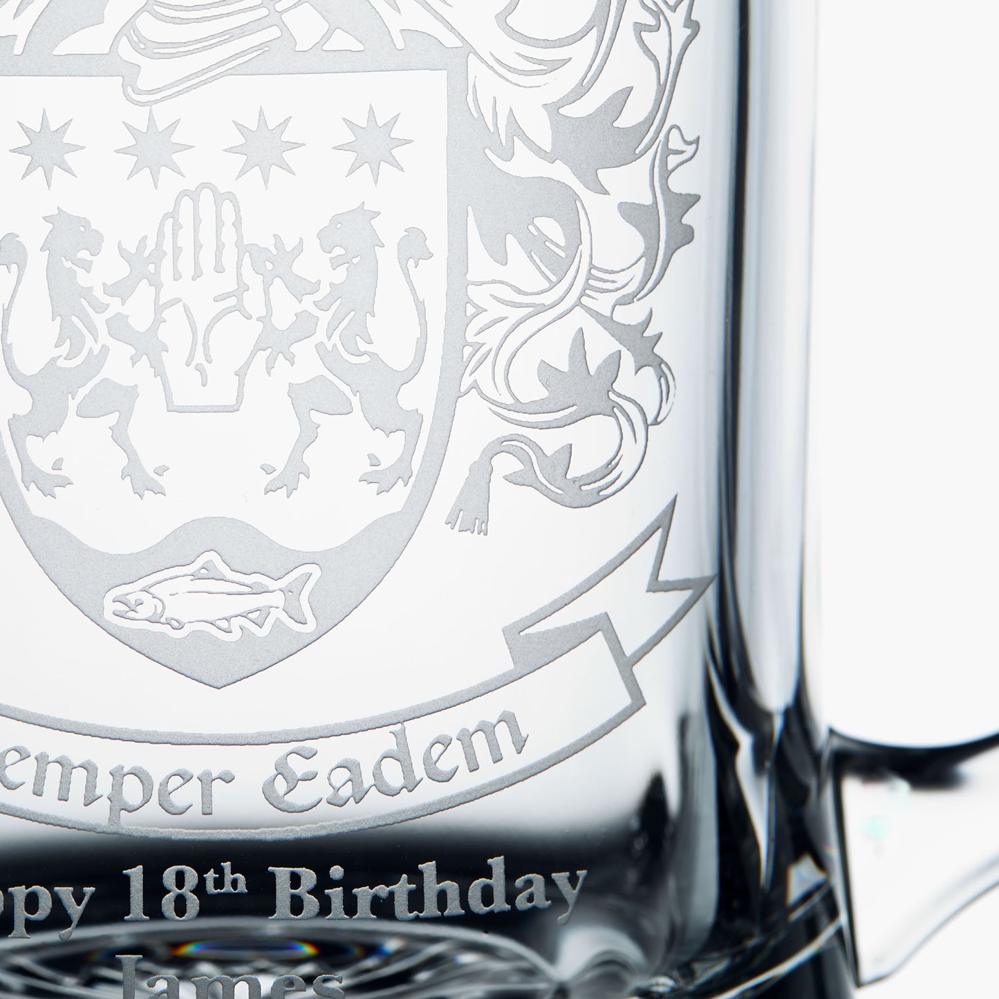 Detail of personalised engraving in a custom coat of arms, family crest glass tankard