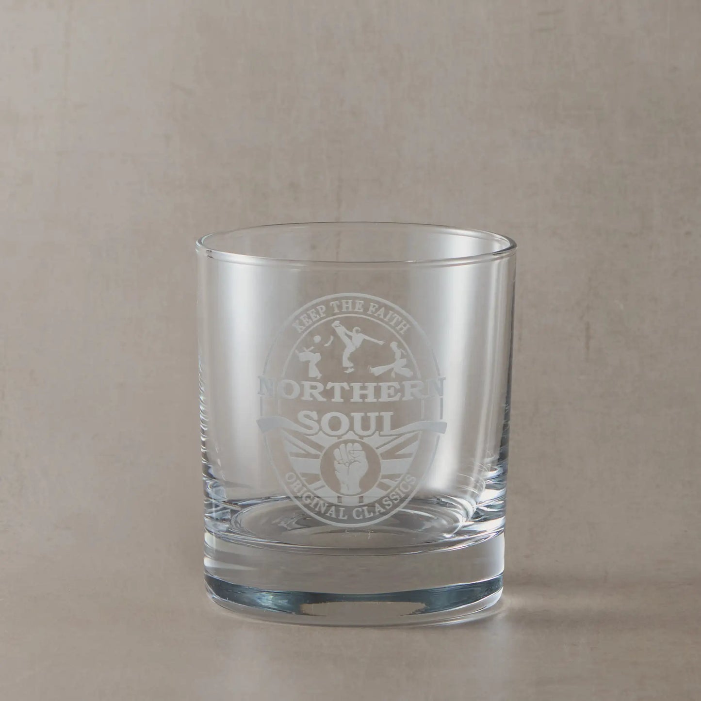Engraved whisky glass with Northern Soul oval beer mat design featuring clenched fist, Union Jack, silhouette dancers, and “Keep the Faith / Original Classics” text