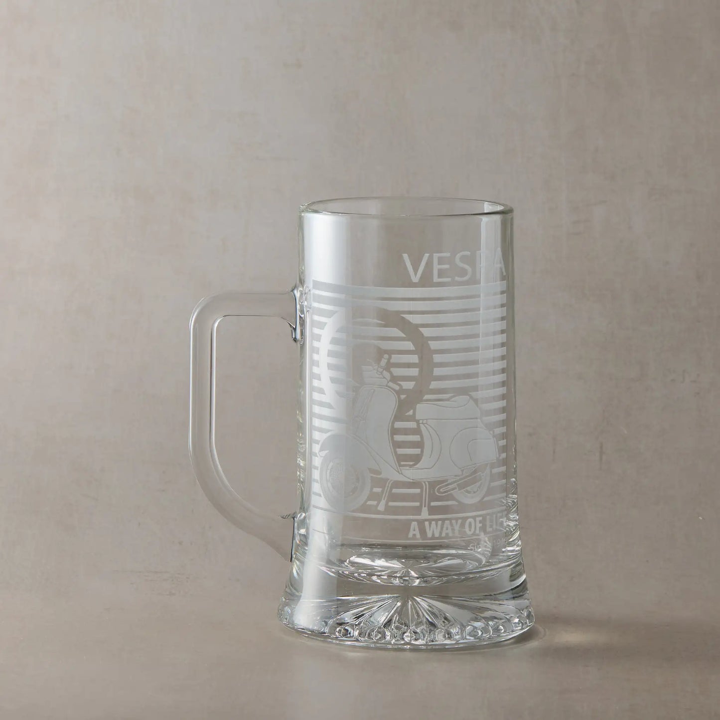 Vespa 50 Special scooter engraved tankard with handle left, photographed on neutral beige background.