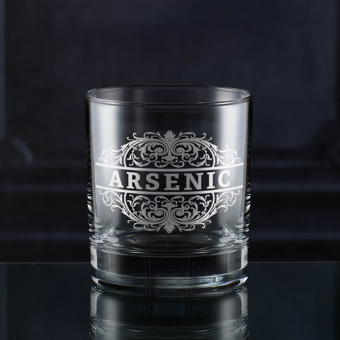 Whisky glass engraved with an ornate Victorian-style ‘Arsenic’ poison label.