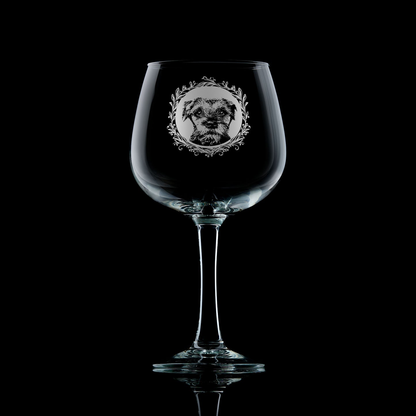 Gin glass with engraved border terrier portrait in circular frame with leafy garland