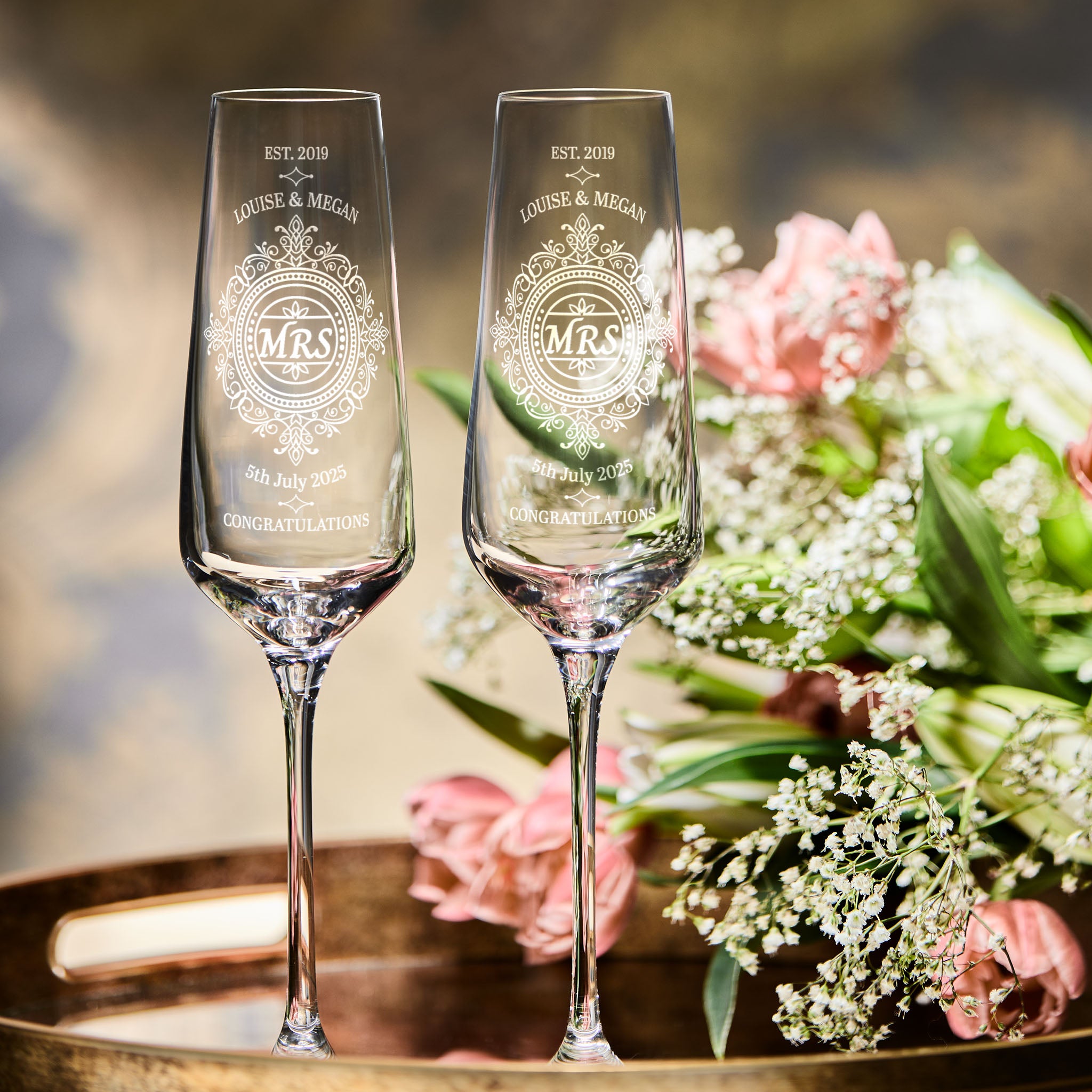 Pair of brides champagne flutes with personalised titles, names and wedding date