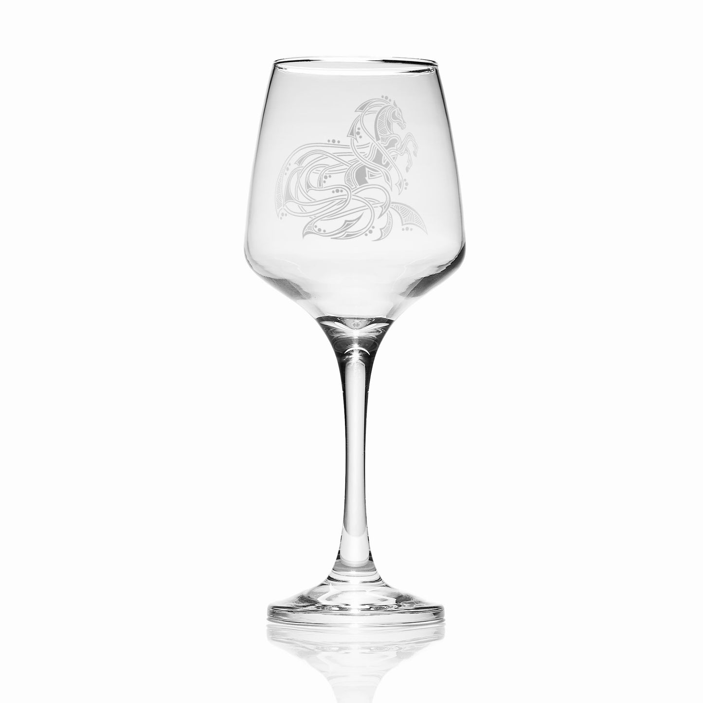 Clear horse wine glass with scottish knotwork engraving on a white background