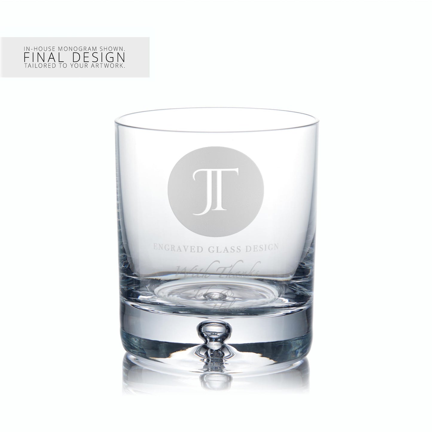 Whisky glass with engraved monogram on a white background