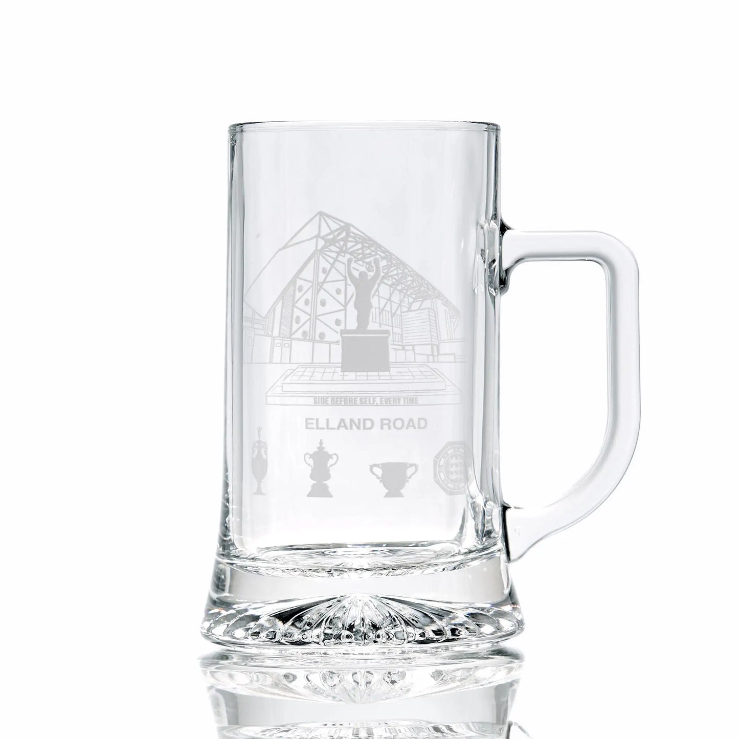 Clear glass tankard engraved with Elland Road stadium, photographed on a white background.