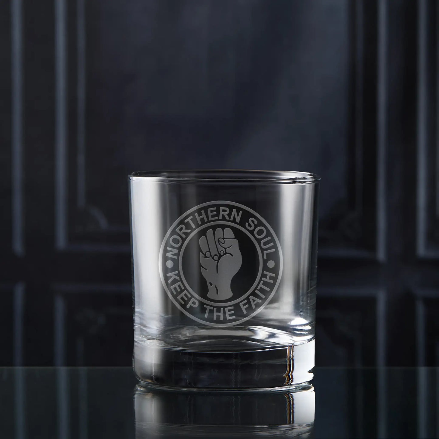 Northern Soul whisky glass with clenched fist symbol and the words “Keep the Faith” in a circular design