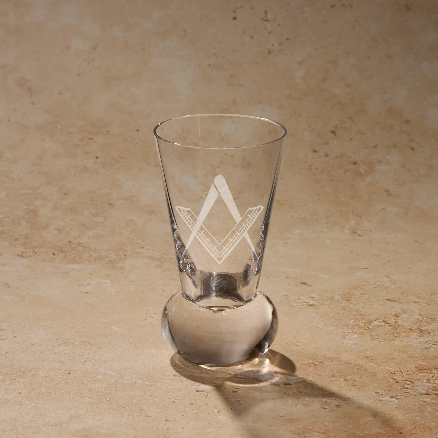 Fellowcraft Second Degree square and compass engraved on firing glass using traditional sandblasting.