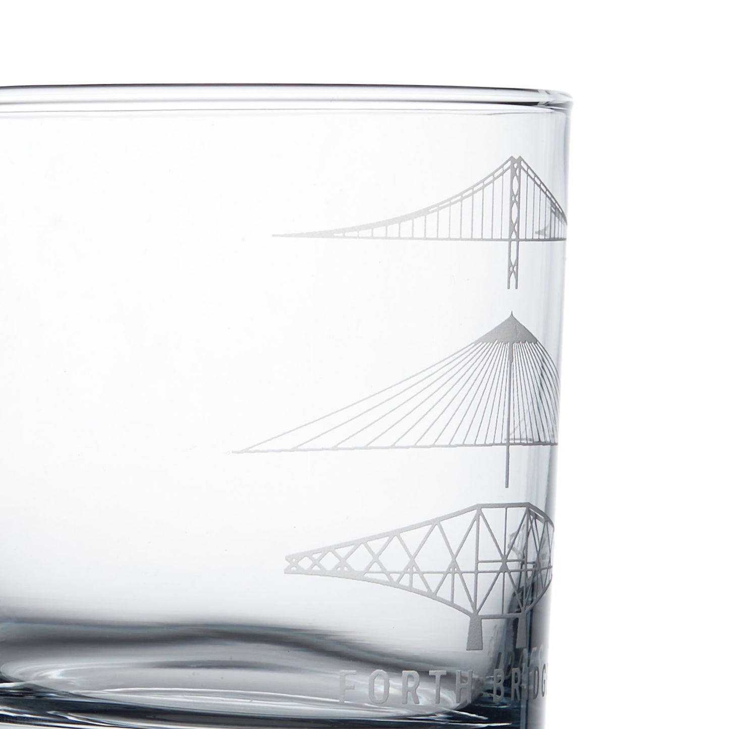 Detail of engraved forth rail bridge on a personalised whisky glass
