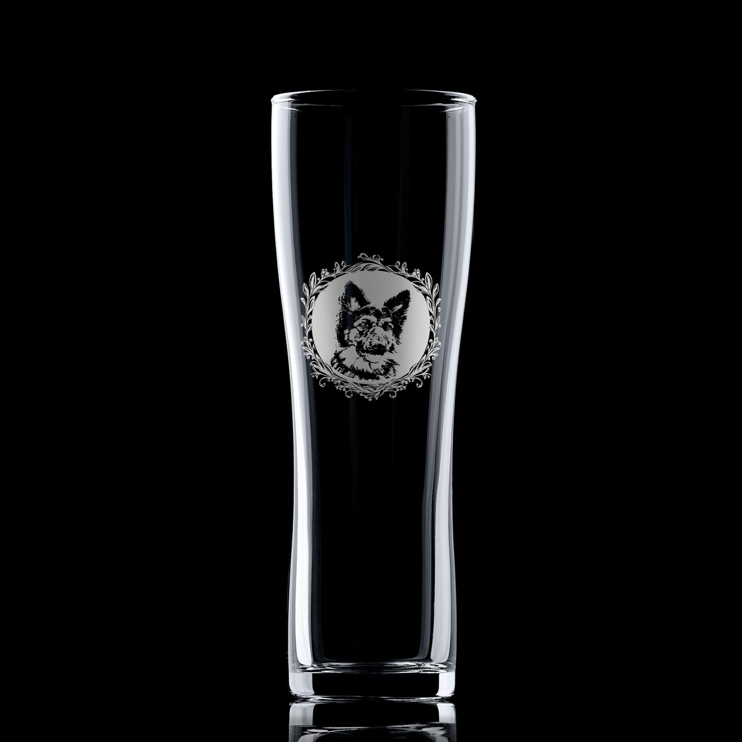 German Shepherd pint glass shown against a dark background, featuring a leafy garland portrait design.