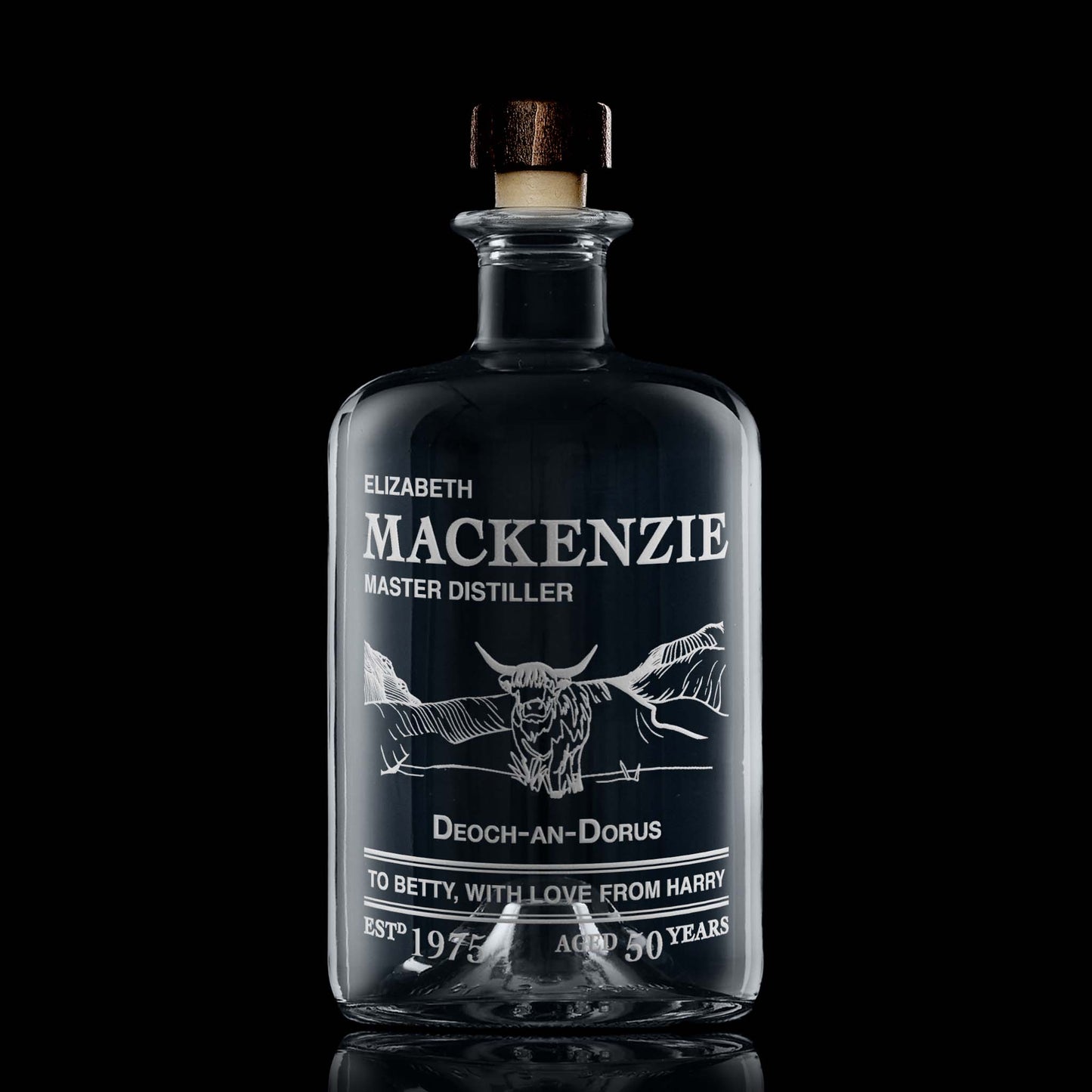 Engraved Decanter bottle featuring a Highland Coo in front of Scottish mountains