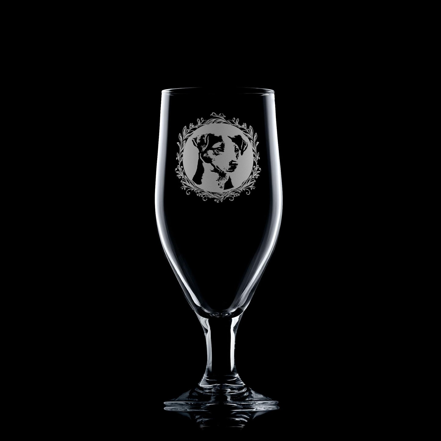 Clear chalice style glass with a Jack Russell Terrier illustration on a black background