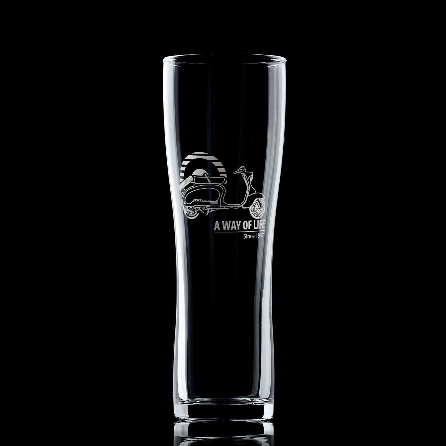 Engraved TV175 pint glass with striped Mod target, shown on dark background