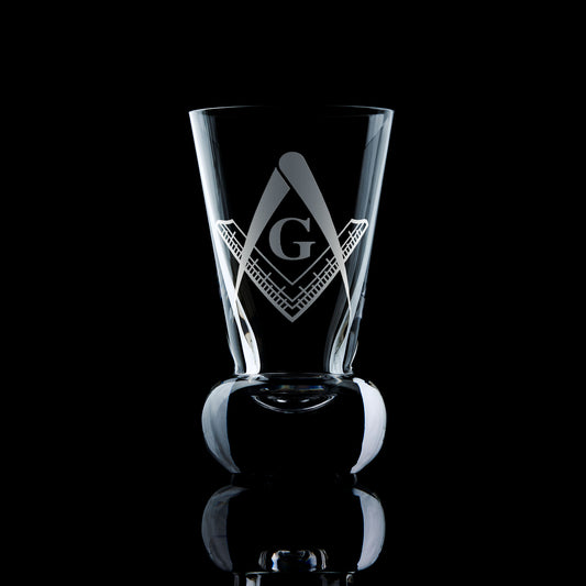 Masonic firing glass with Master Mason 3rd Degree Square & Compass and letter G engraved, shown on black background
