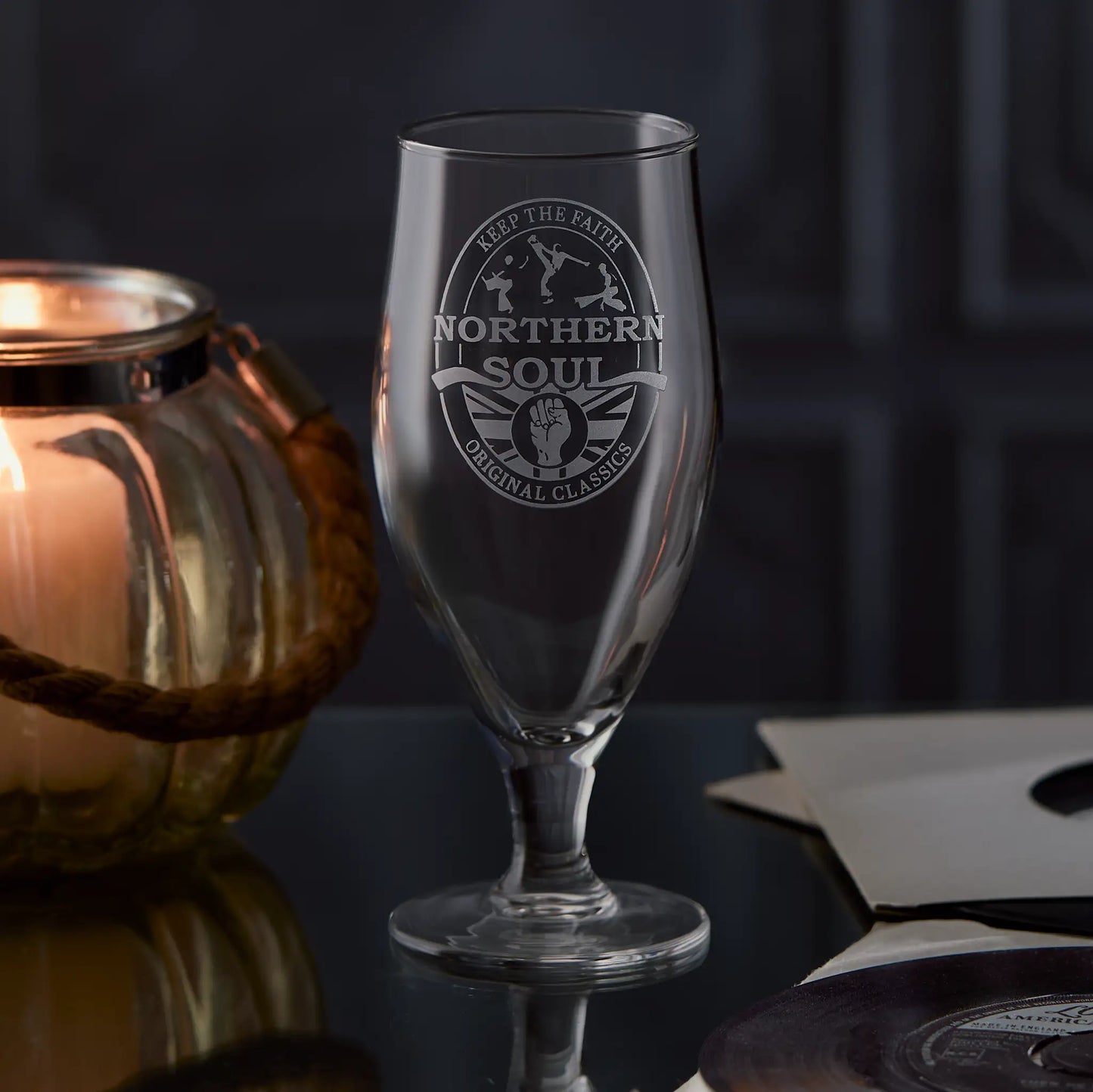 Stemmed beer glass with 'Northern Soul Original Classics' logo on a black background