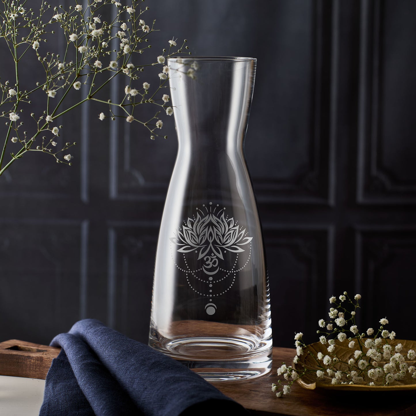 Glass carafe engraved with lotus flower, Om symbol, and moon phase design – ideal for yoga spaces, spiritual rituals, and wellbeing gifting