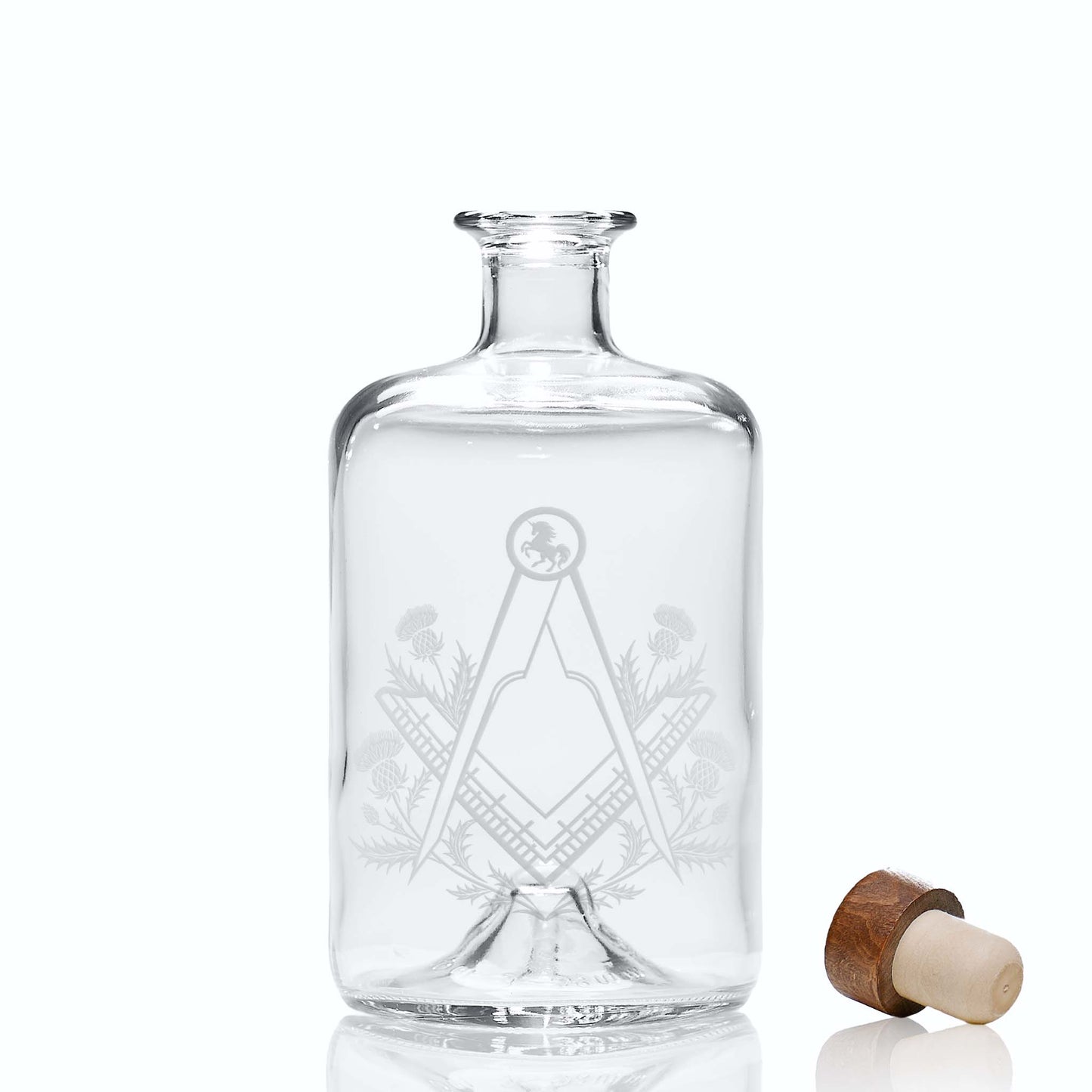 Masonic decanter engraved with Scottish Unicorn, thistles, and Square & Compass on a white background