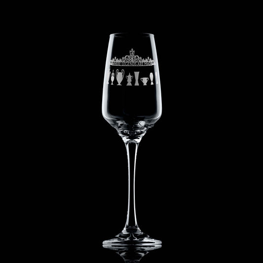 Engraved prosecco glass with Shankly Gates entrance to a Livepool football stadium and trophy silhouettes, shown front-facing.