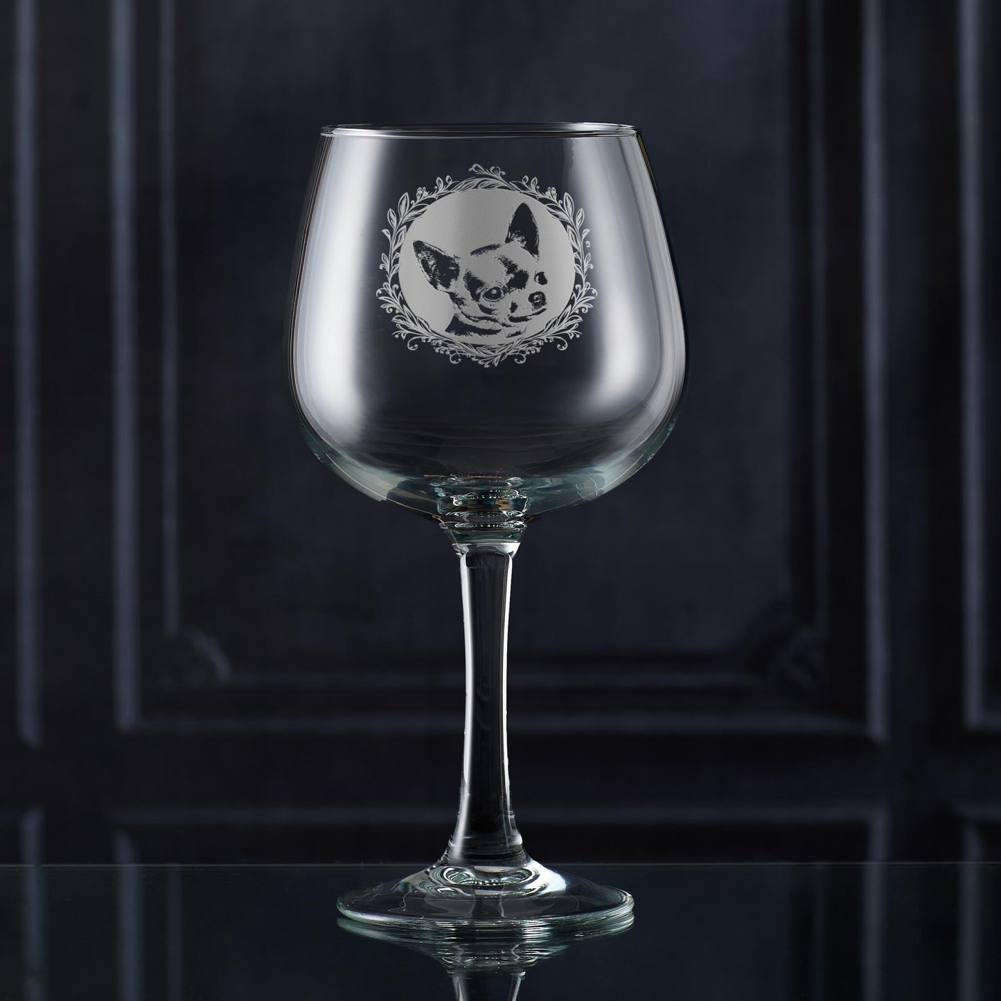 Gin glass with engraved shorthaired chihuahua portrait in circular frame with leafy garland