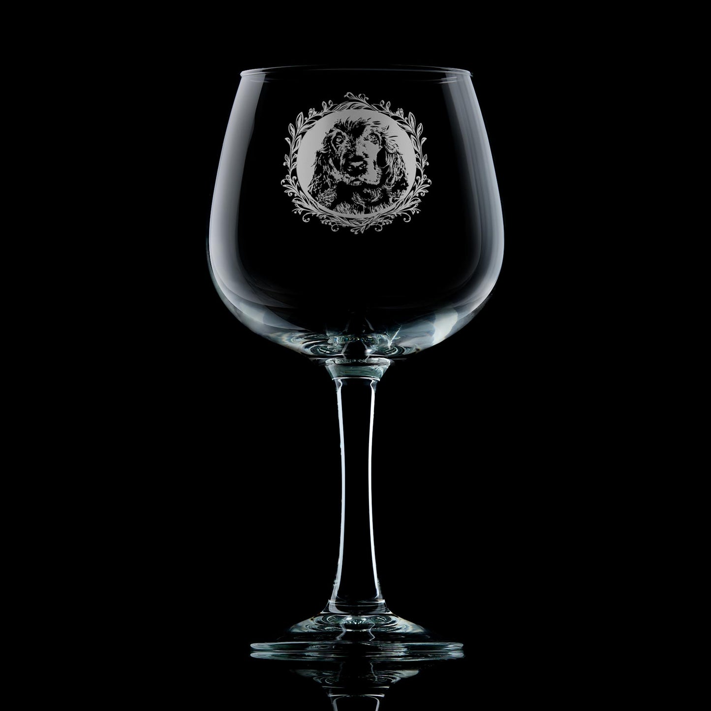 Show Cocker Spaniel gin glass displayed in front of dark wooden panelling, featuring a leafy garland dog portrait design by Just The Ticket.