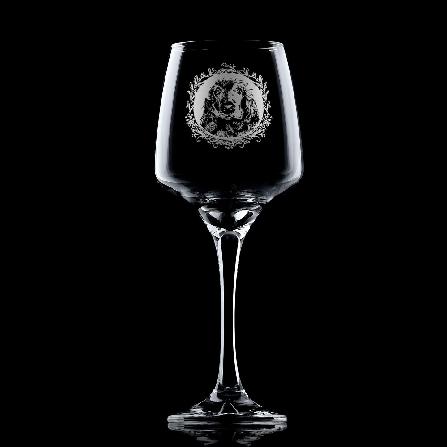 Stemmed wine glass with engraved show cocker spaniel framed with leafy garland