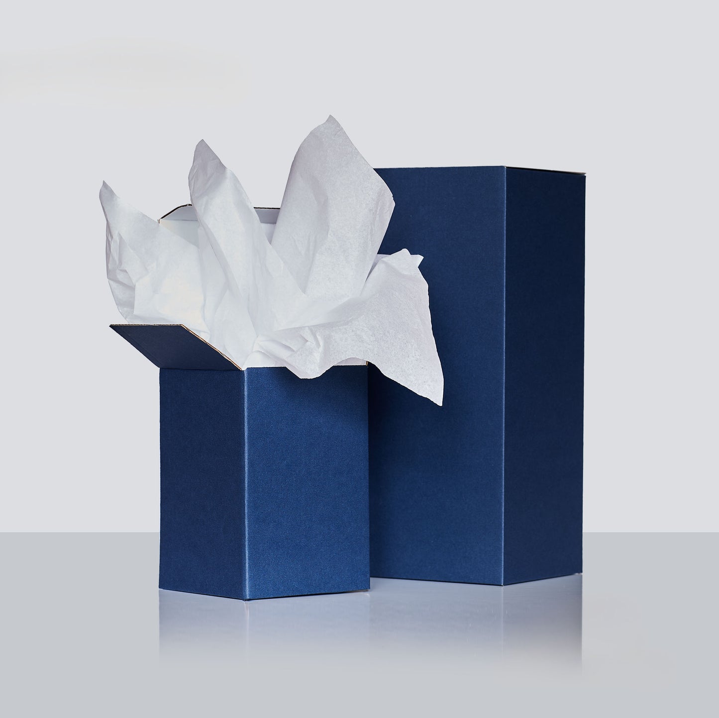 signature blue gift boxes lined with white tissue paper