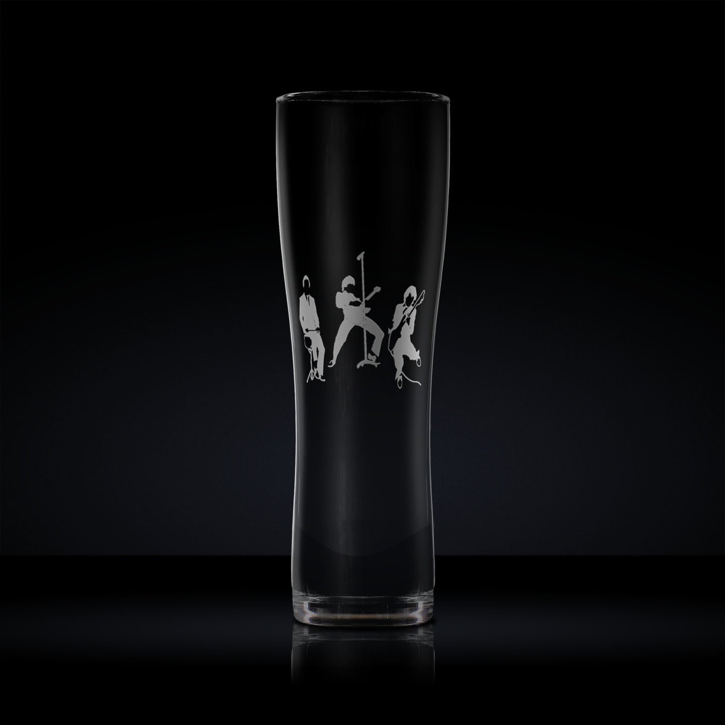 Engraved pint glass with a silhouette of a three-piece band – guitar, bass, and drums – in a mod revival-inspired style
