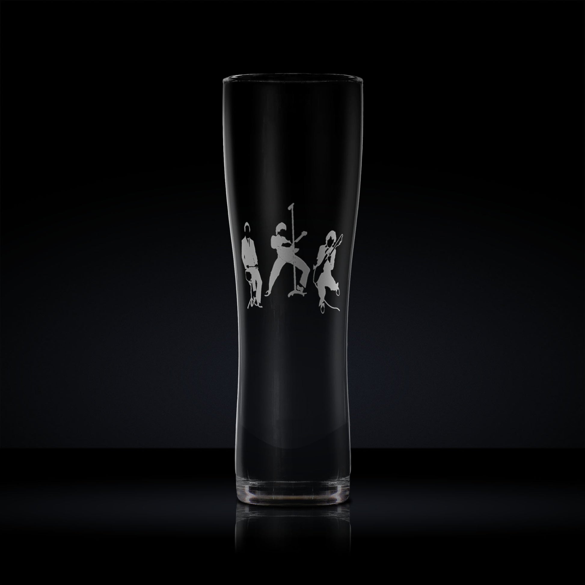 Engraved pint glass with a silhouette of a three-piece band – guitar, bass, and drums – in a mod revival-inspired style