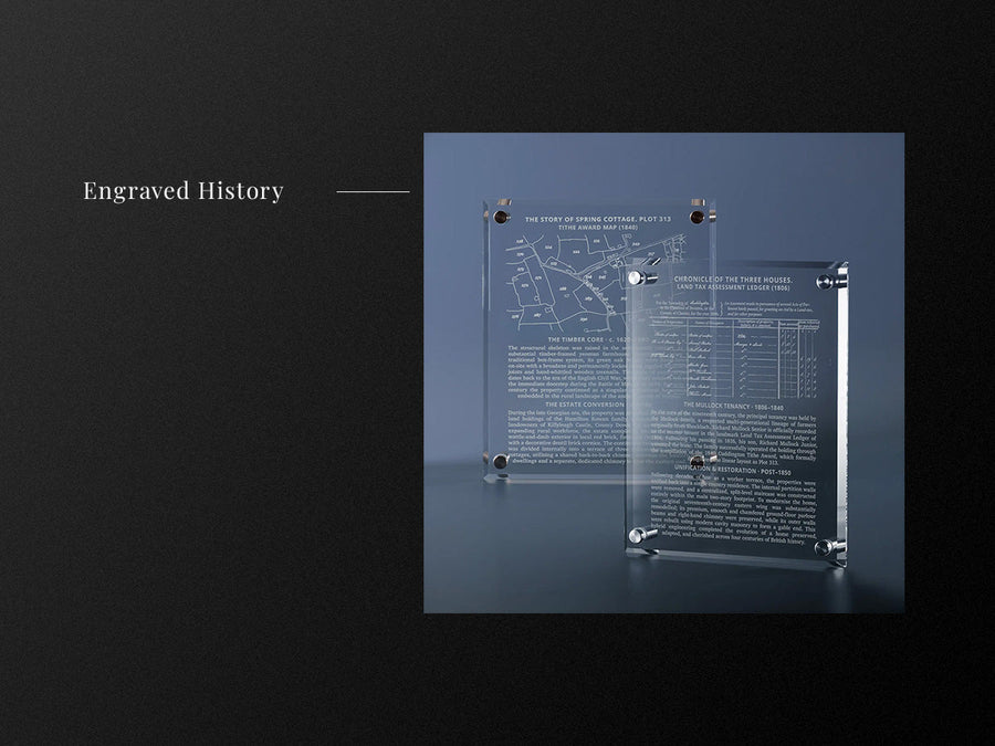 Engraved glass wall plaques featuring historic maps and tax ledgers with paragraphs