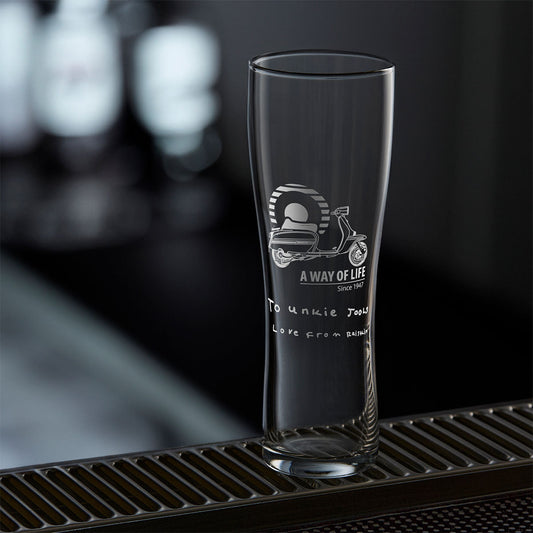 A personalised pint glass engraved with a lambretta GP scooter and handwritten message