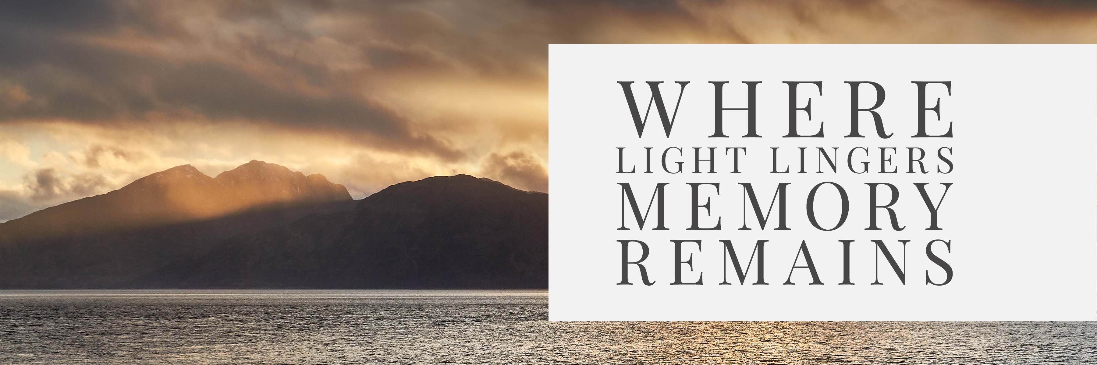 Golden hour over a Scottish loch with mountains in silhouette and sunset reflections — banner image for the Mountain and Memory engraved glassware collection.