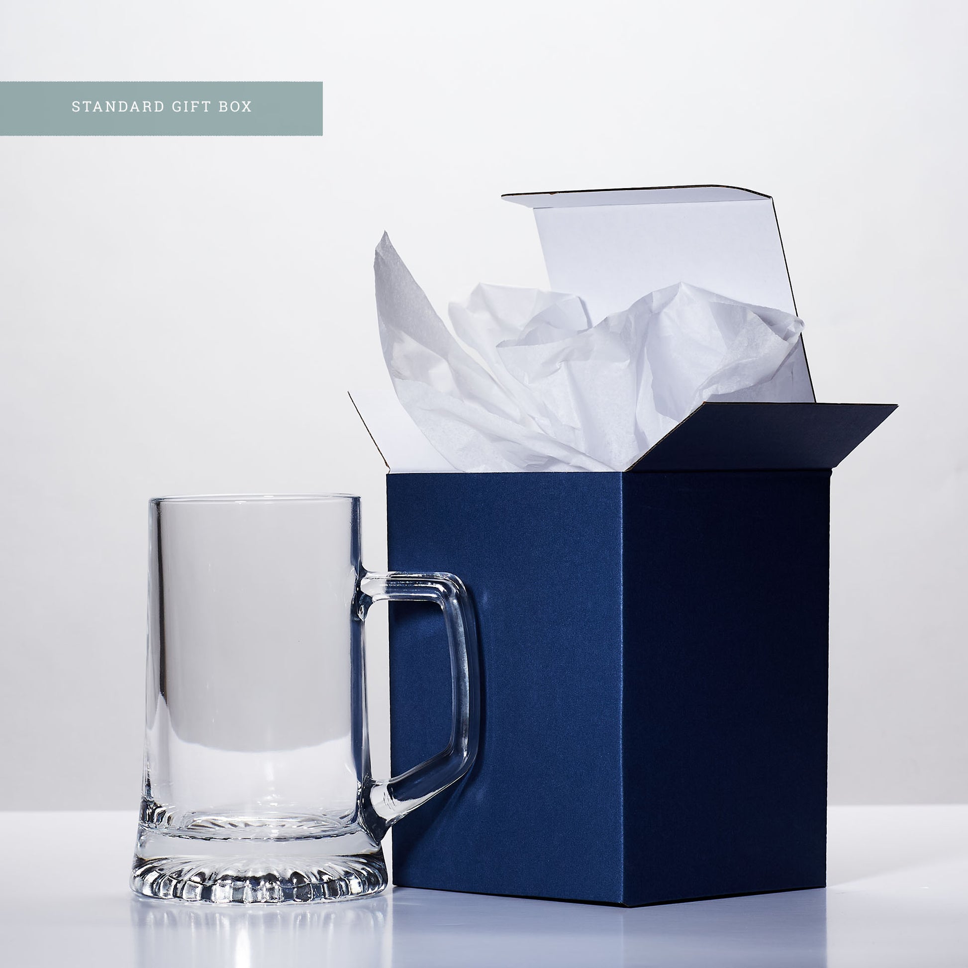 blue gift box and engraved glass tankard