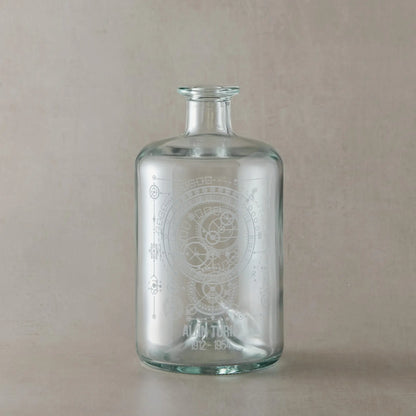 Clear glass apothecary bottle engraved with Alan Turing inspired design, featuring a dark wood synthetic cork stopper, displayed on a white background.