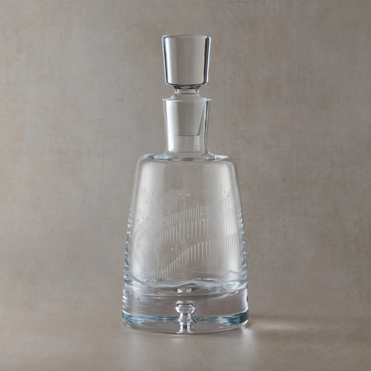 Handmade decanter with engraved wraparound Aurora Borealis and stars design on a beige background