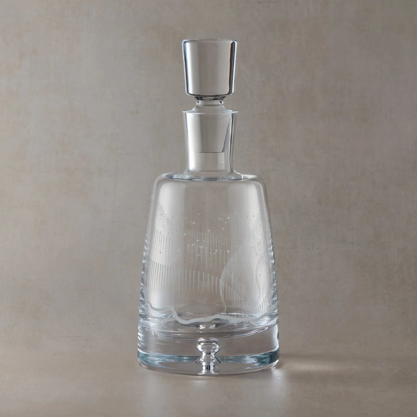 Wraparound Aurora Borealis and stars design engraved on a glass decanter