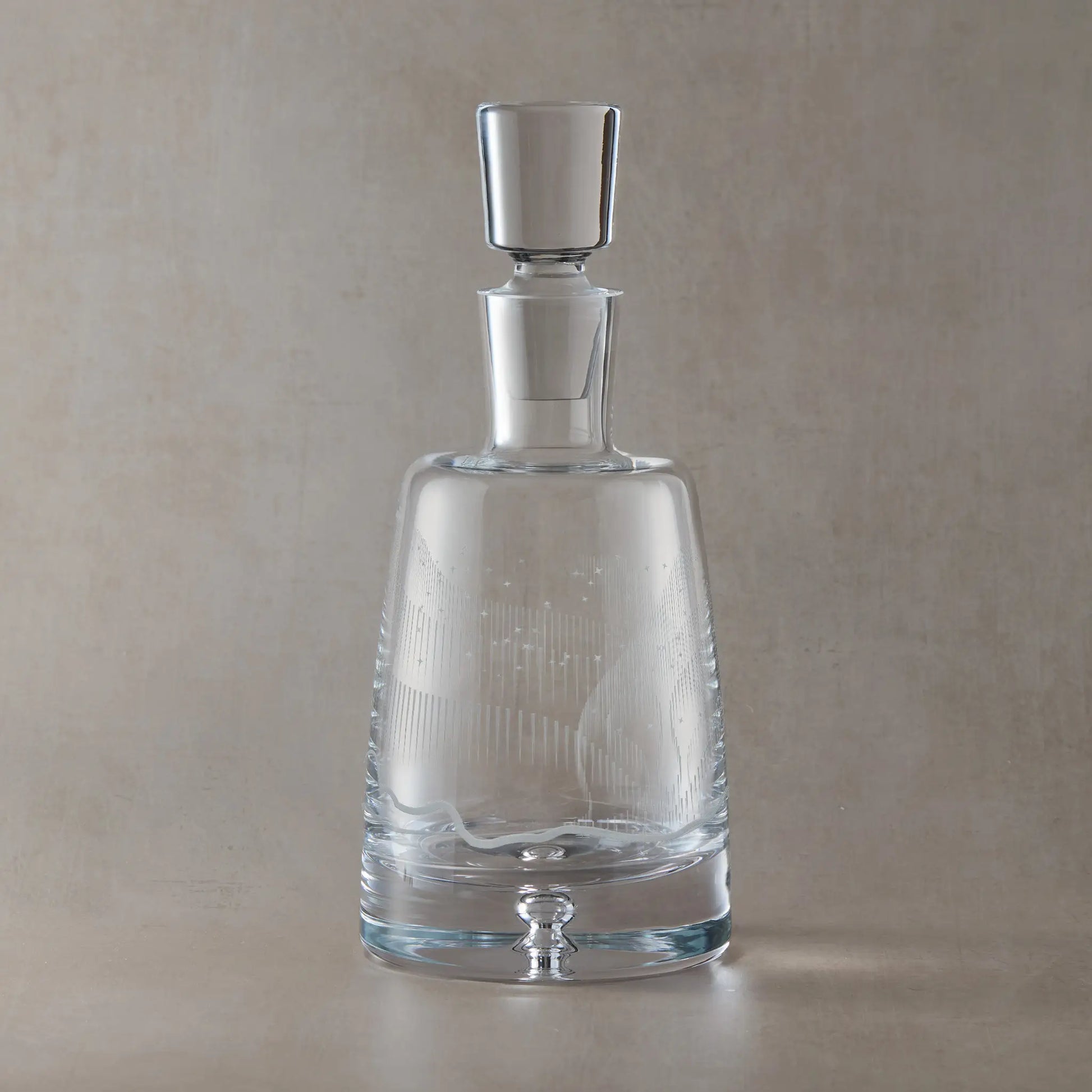 Wraparound Aurora Borealis and stars design engraved on a glass decanter