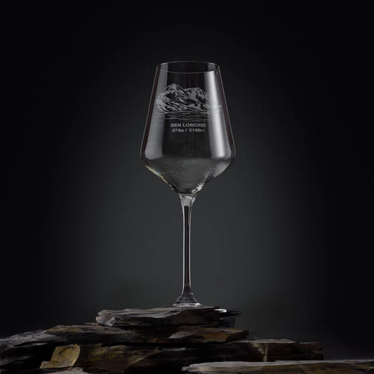 Wine glass engraved with a view of Ben Lomond, on a dark background