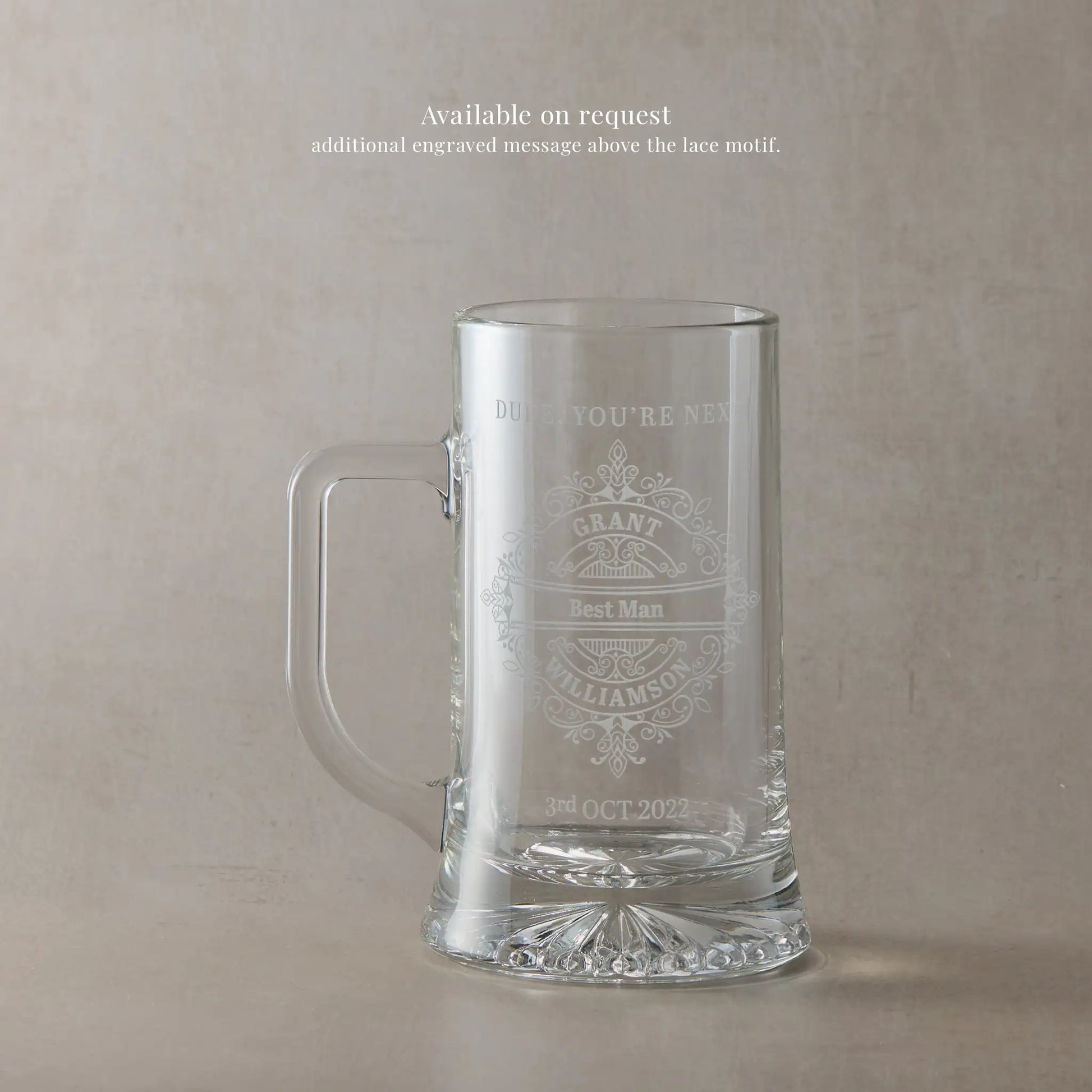 personalised etched glass tankard on a beige background with text 'BEST MAN' and wedding date.