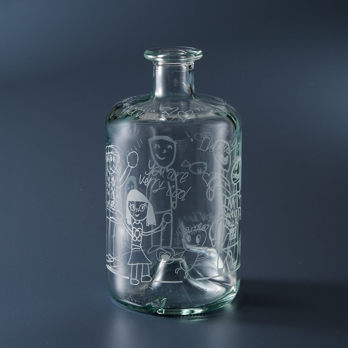 Engraved apothecary decanter featuring childrens drawings and handwritten text