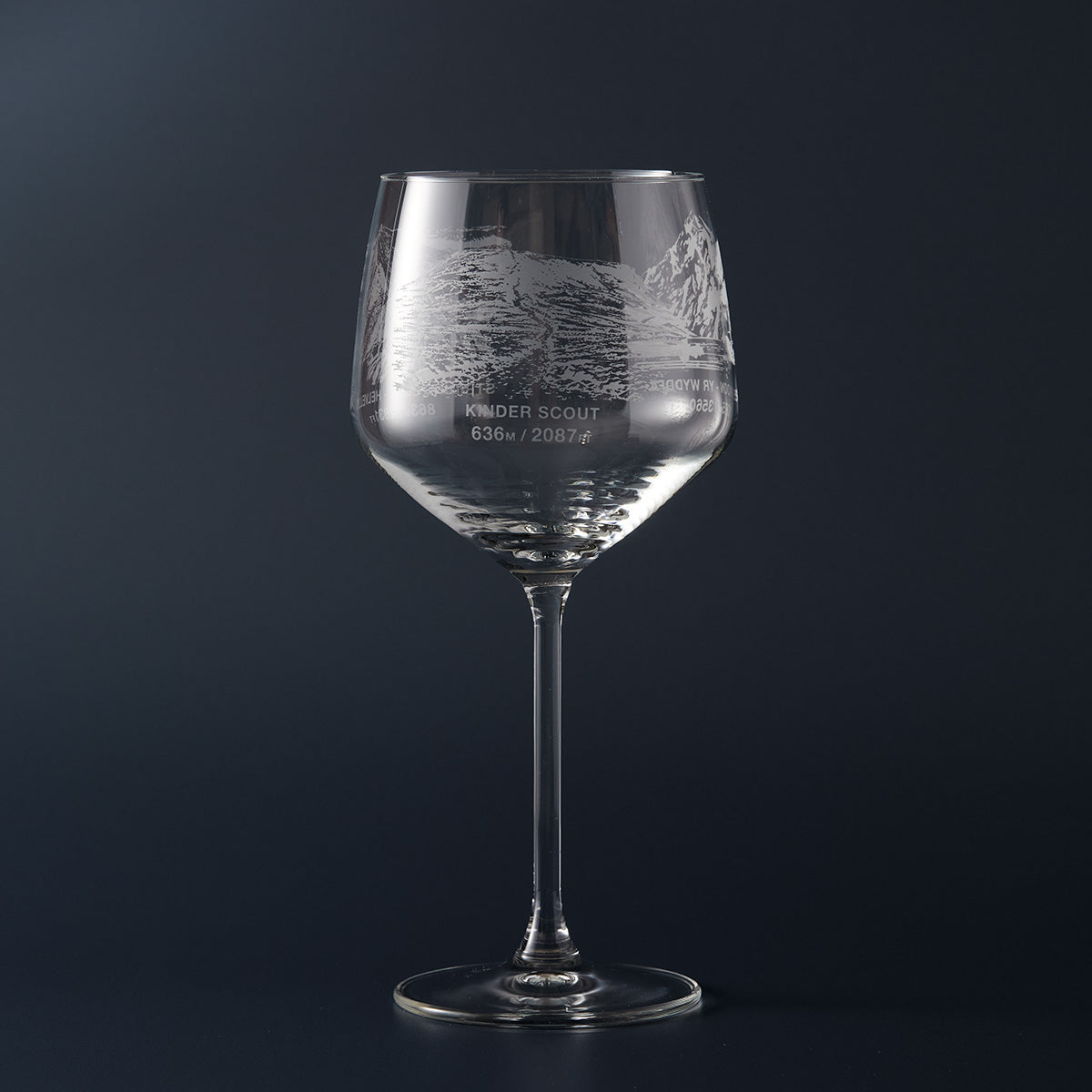 Engraved gin glass with an illustration of Kinder Scout, name and summit height
