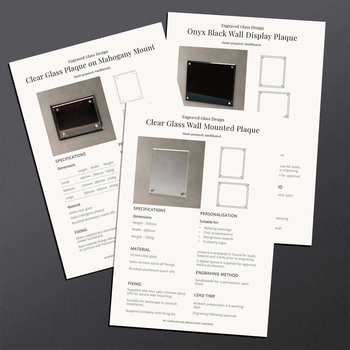 Two printed technical specification sheets for an engraved glass display plaque. The sheets include product photos, dimensions, mounting options, and installation instructions.