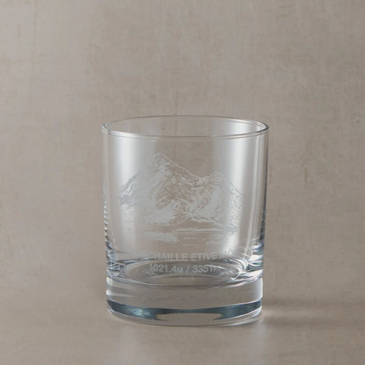 Whisky glass engraved with Buachaille Etive Mor, photographed on a neutral coloured backround