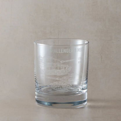 Front-facing whisky glass with detailed Challenger 3 tank engraving, shown on a black background to emphasise etched design.