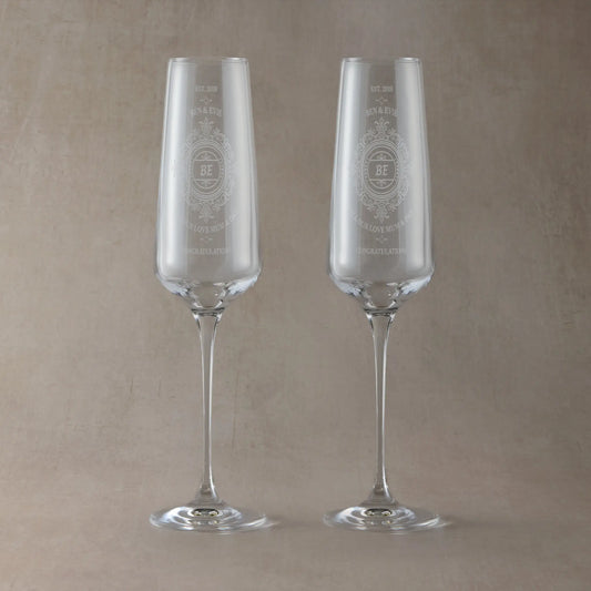 Pait of Anniversary Champagne flutes engraved with lace design and personalised with names and dedication