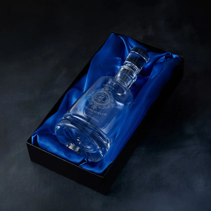 Engraved Chantilly lace decanter presented in a satin-lined gift box, photographed on deep blue background