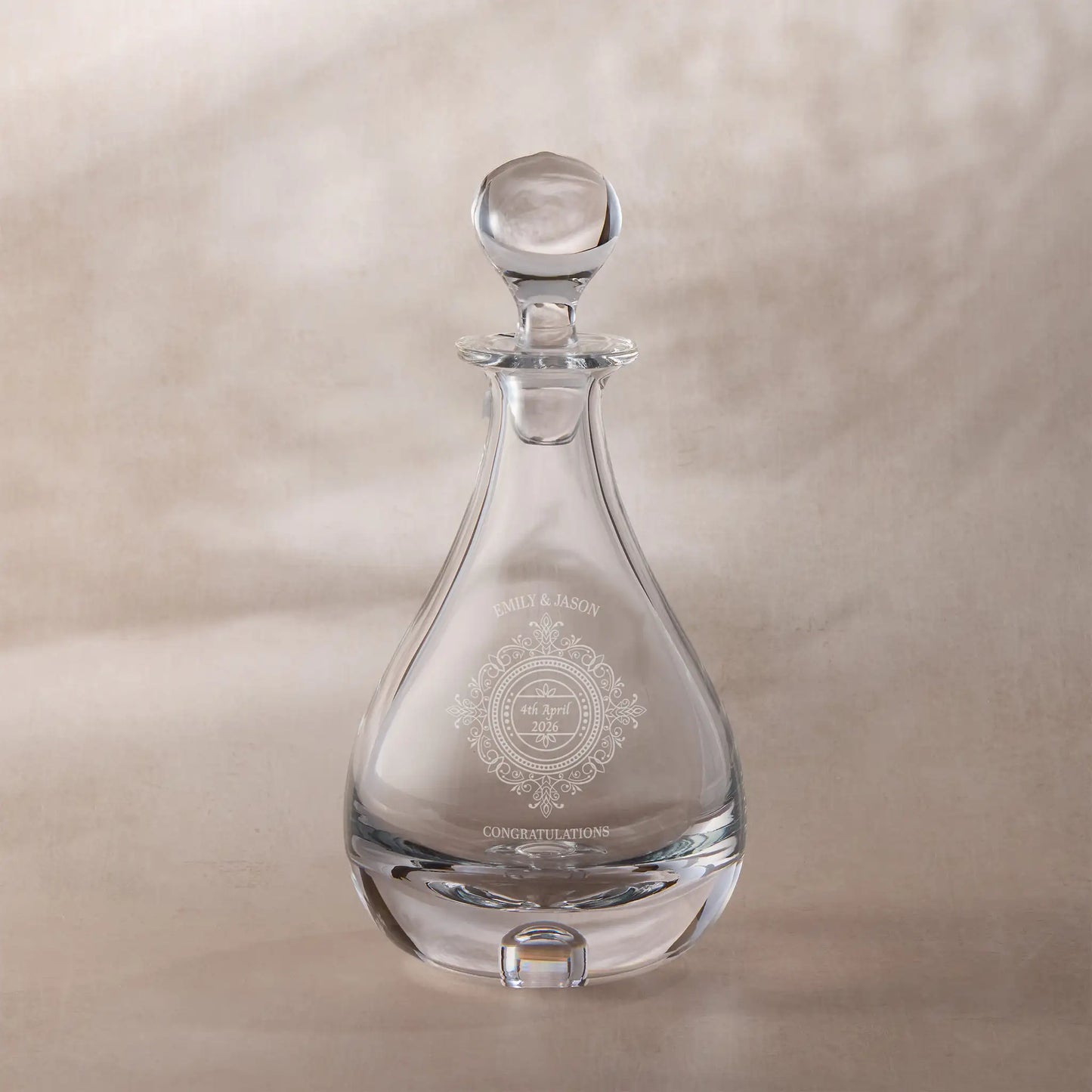 Personalised wedding decanter with engraved chantilly lace design on a beige background
