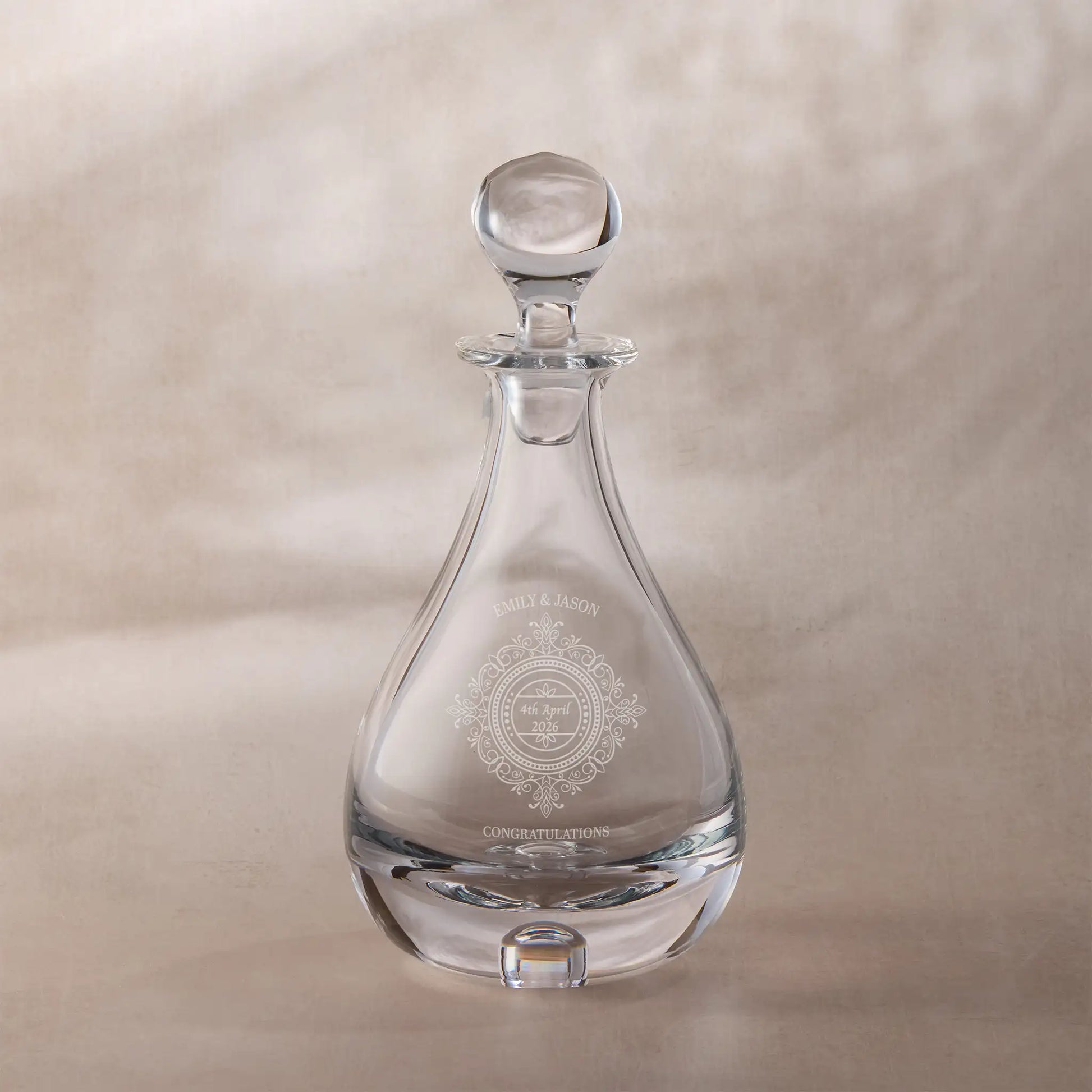 Personalised wedding decanter with engraved chantilly lace design on a beige background